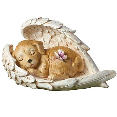 angel and dog figurine|dog sleeping in angel wings.